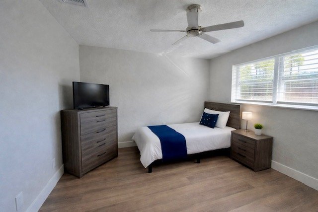 Private bedroom at Serenity Living Home Care II memory care home in Palm Beach Gardens