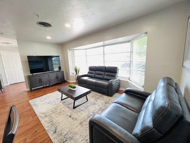 Living room with comfortable seating at Serenity Living Home Care on Buttercup Circle